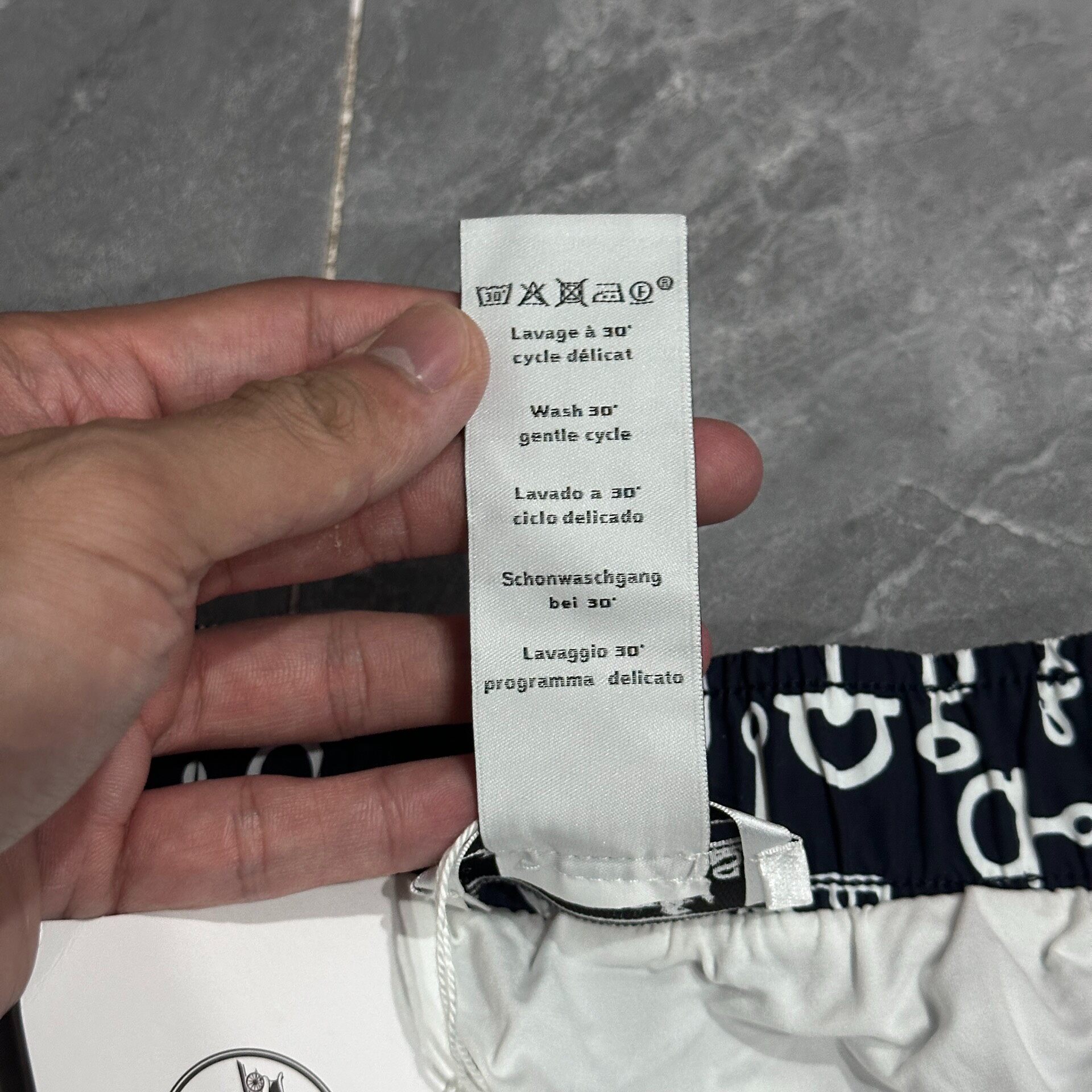 Hermes Lock Detail Black Beach Shorts — detail
