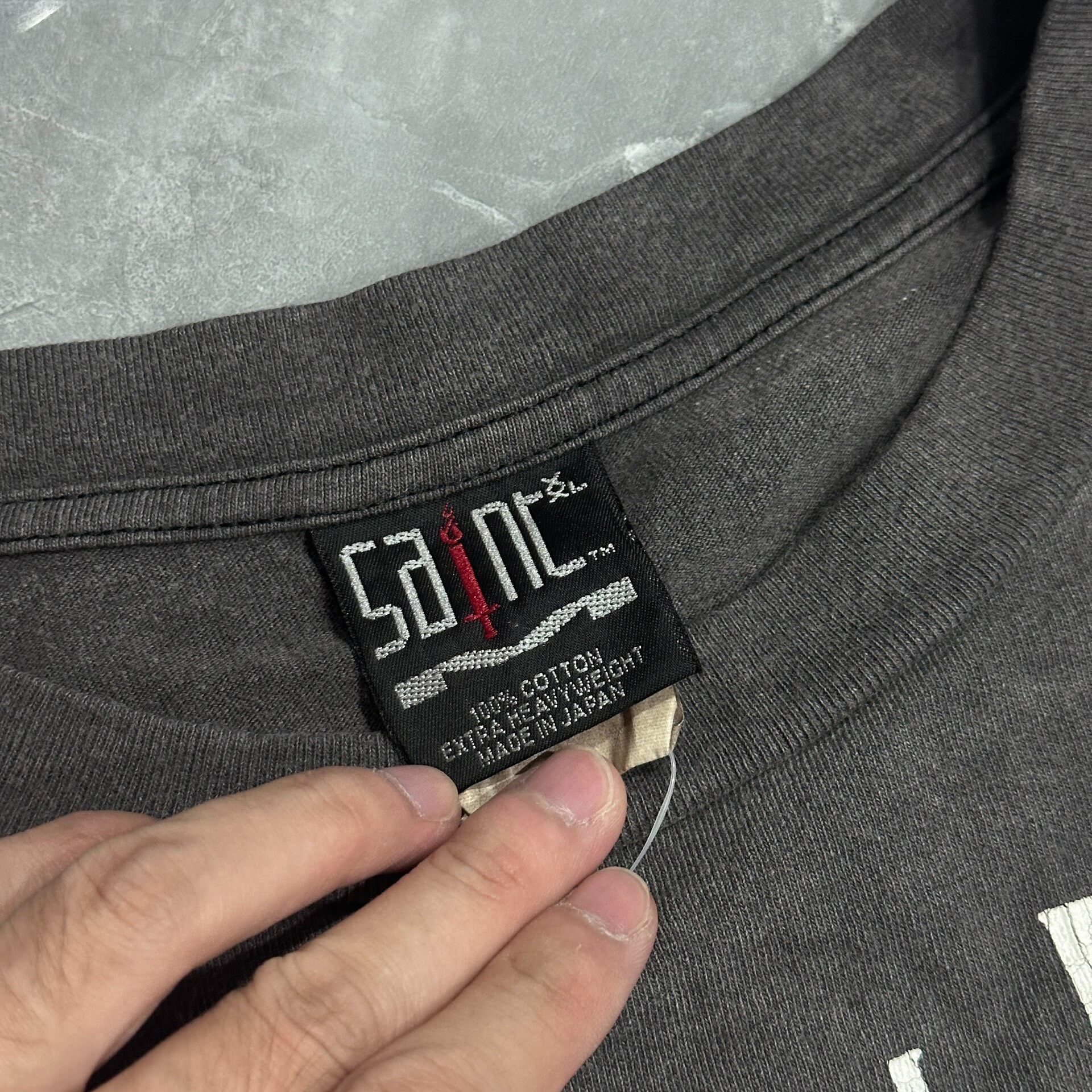 Saint Michael Faded Black Graphic Tee — label
