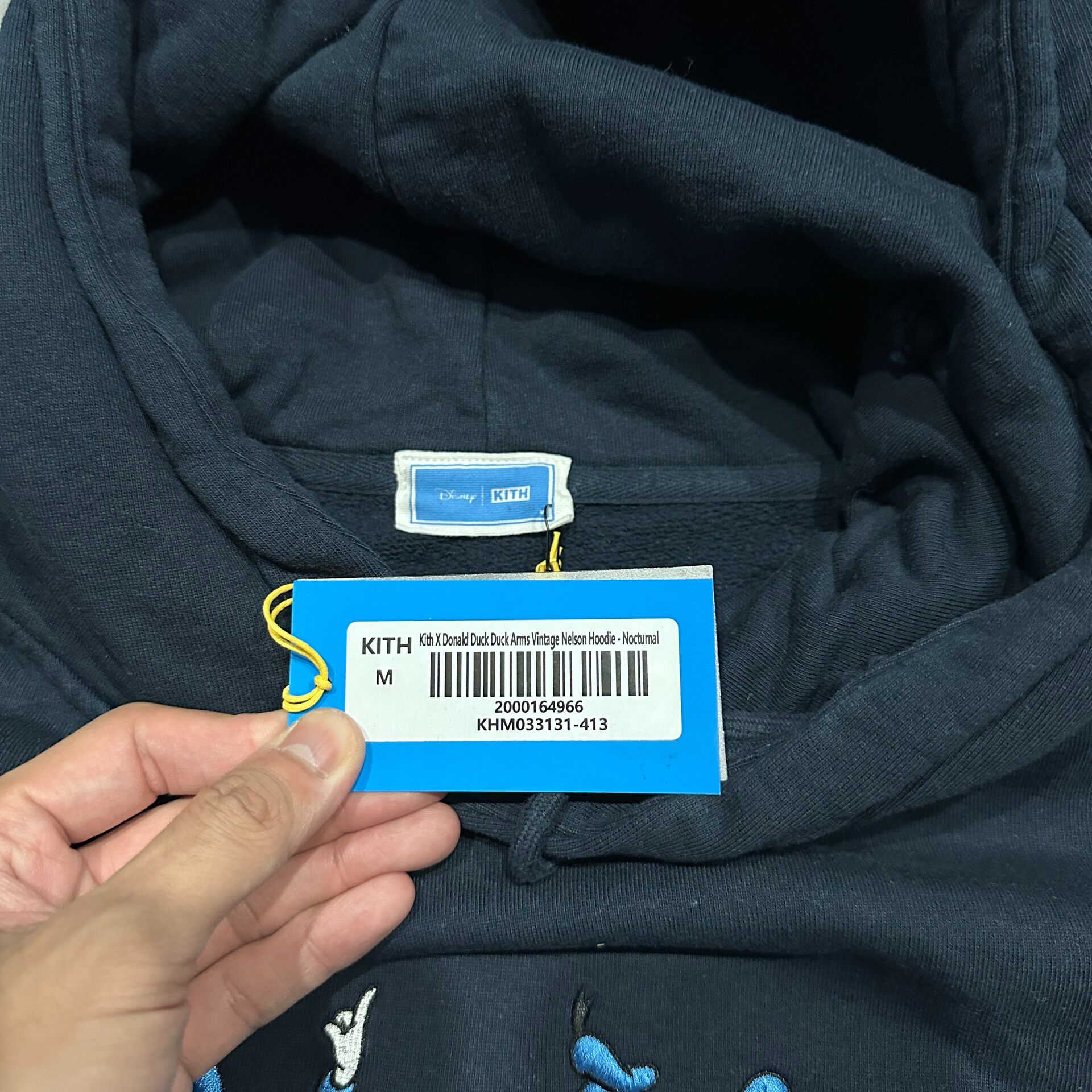 Kith x Disney Embroidered Hoodie — label
