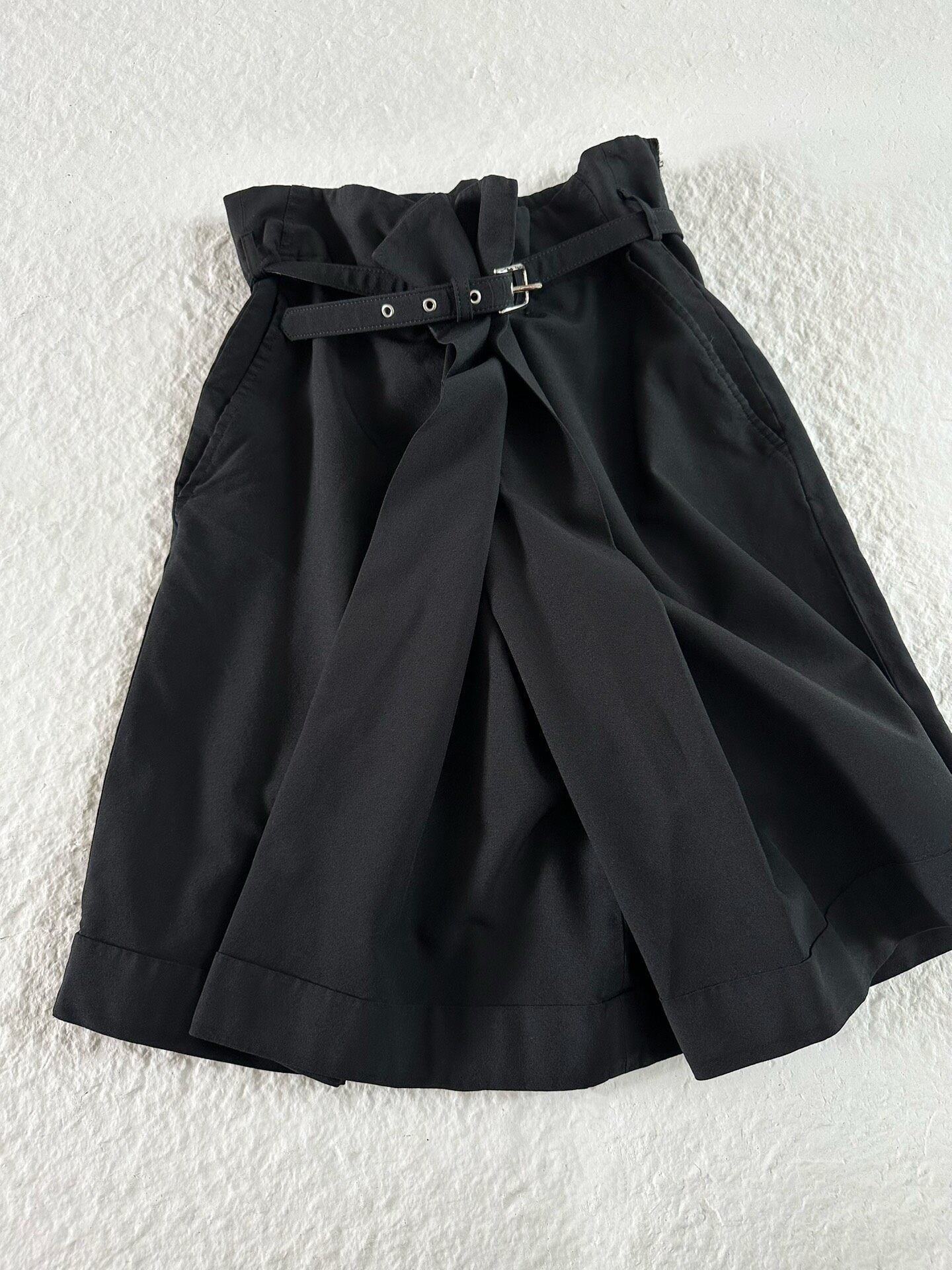 Comme des Garcons Asymmetric Mid-Length Shorts — label