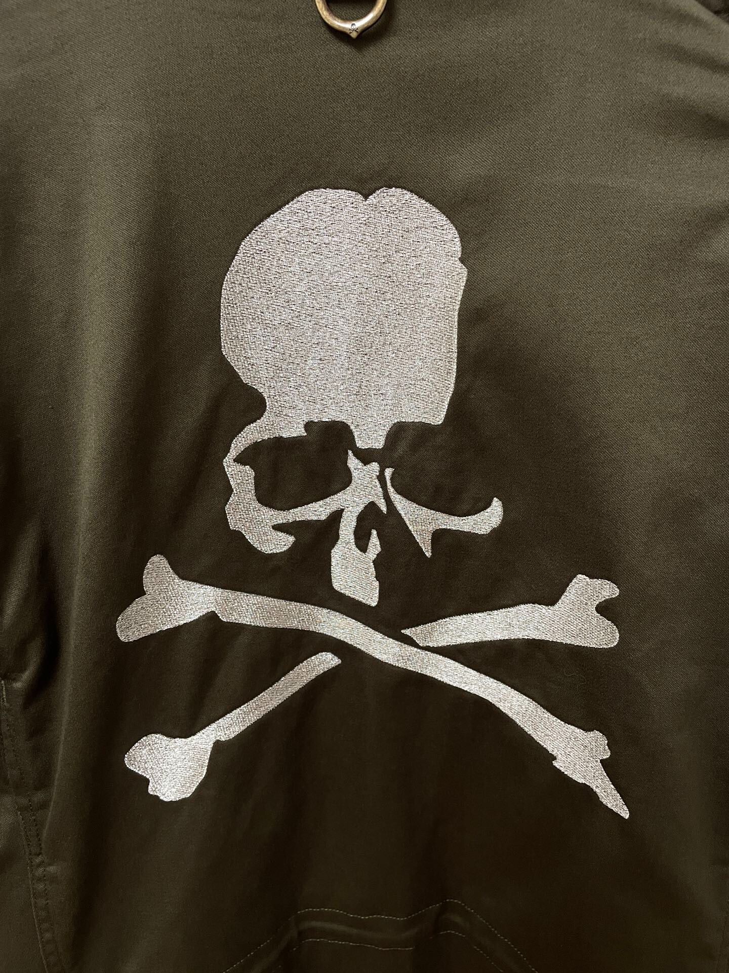 Mastermind Silver Skull Embroidered Trench Coat — detail