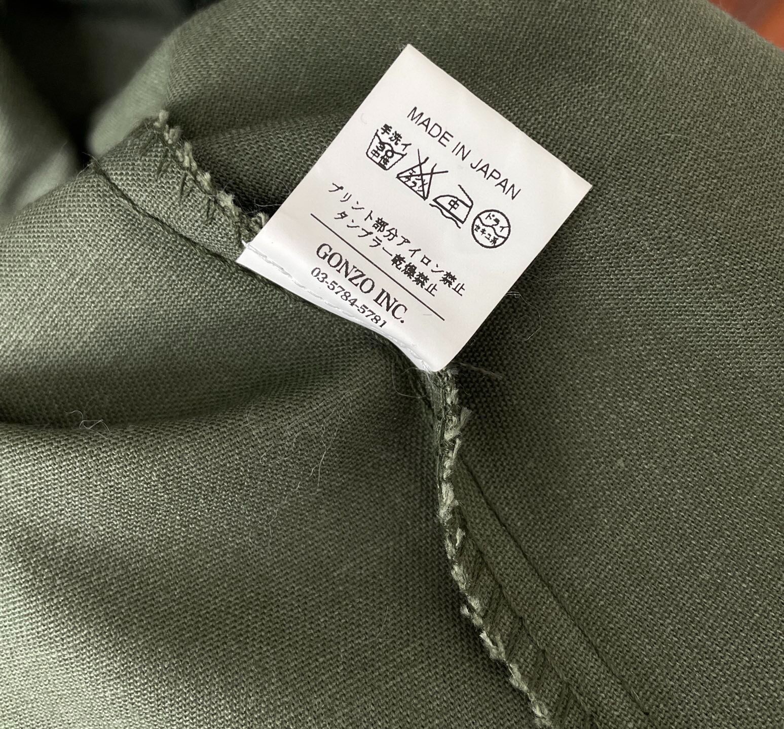 FPAR Media Guerrilla Olive Shirt — label