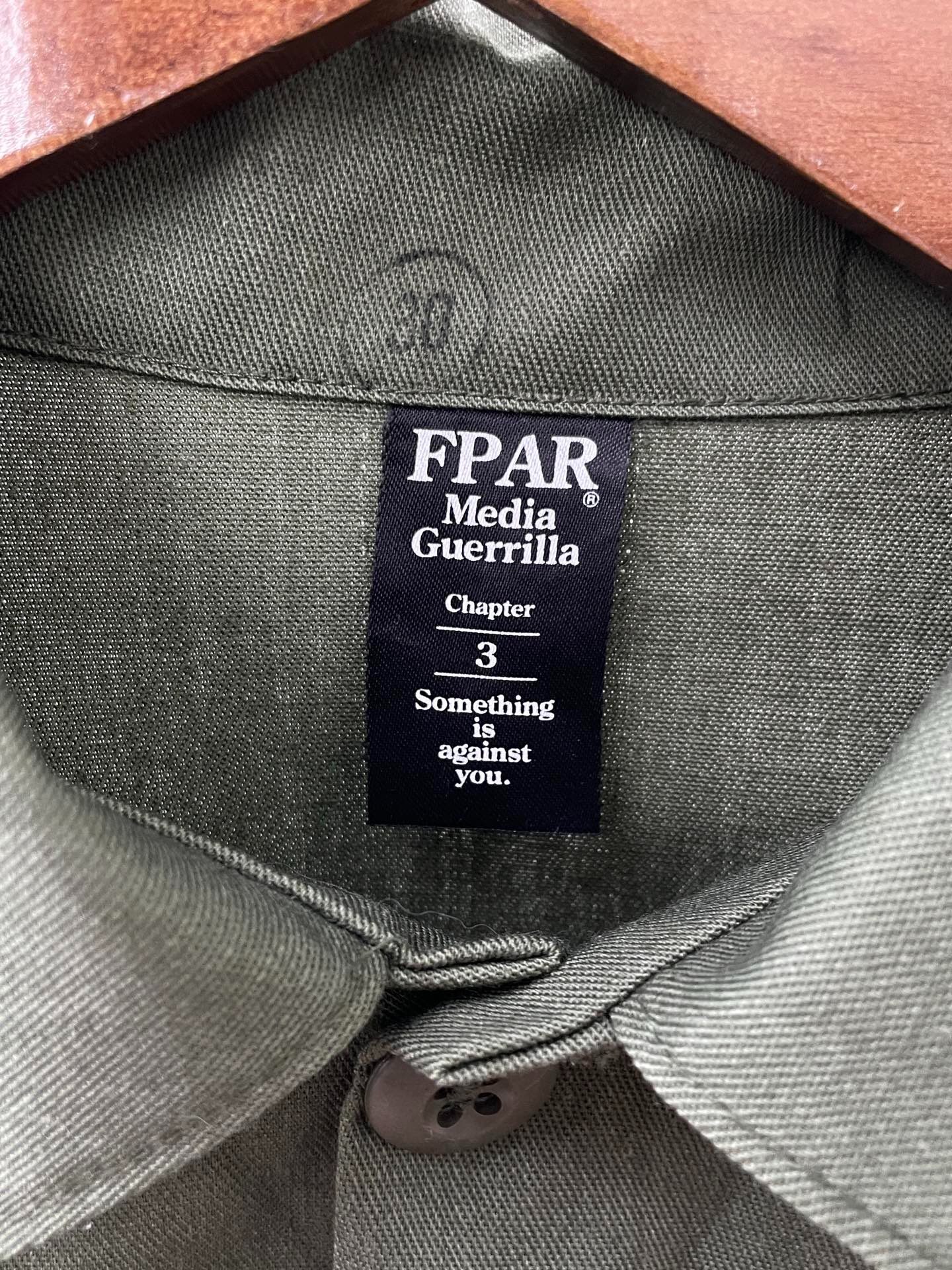 FPAR Media Guerrilla Olive Shirt — detail