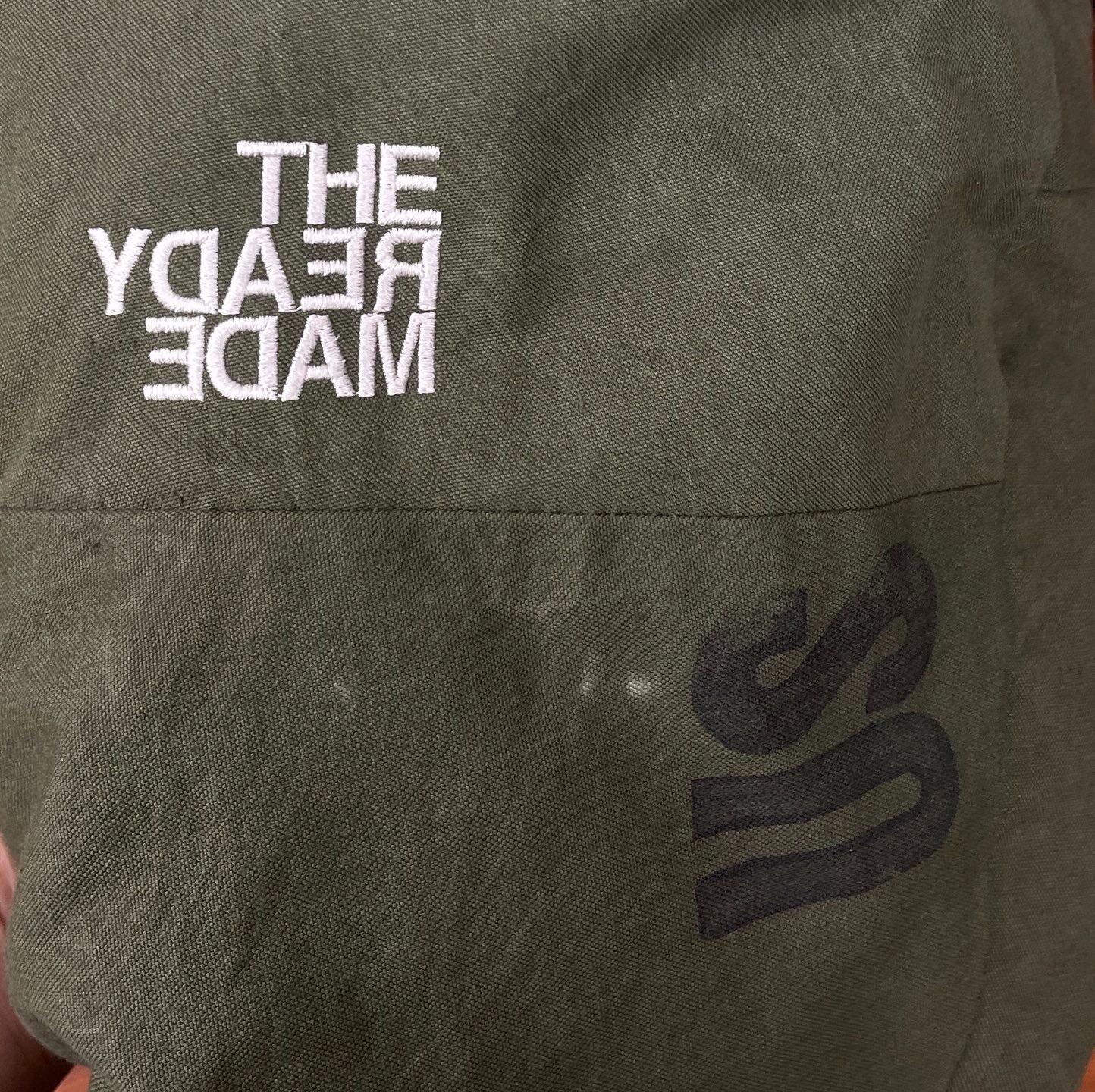 Olive Green Parka With Orange Lining — detail