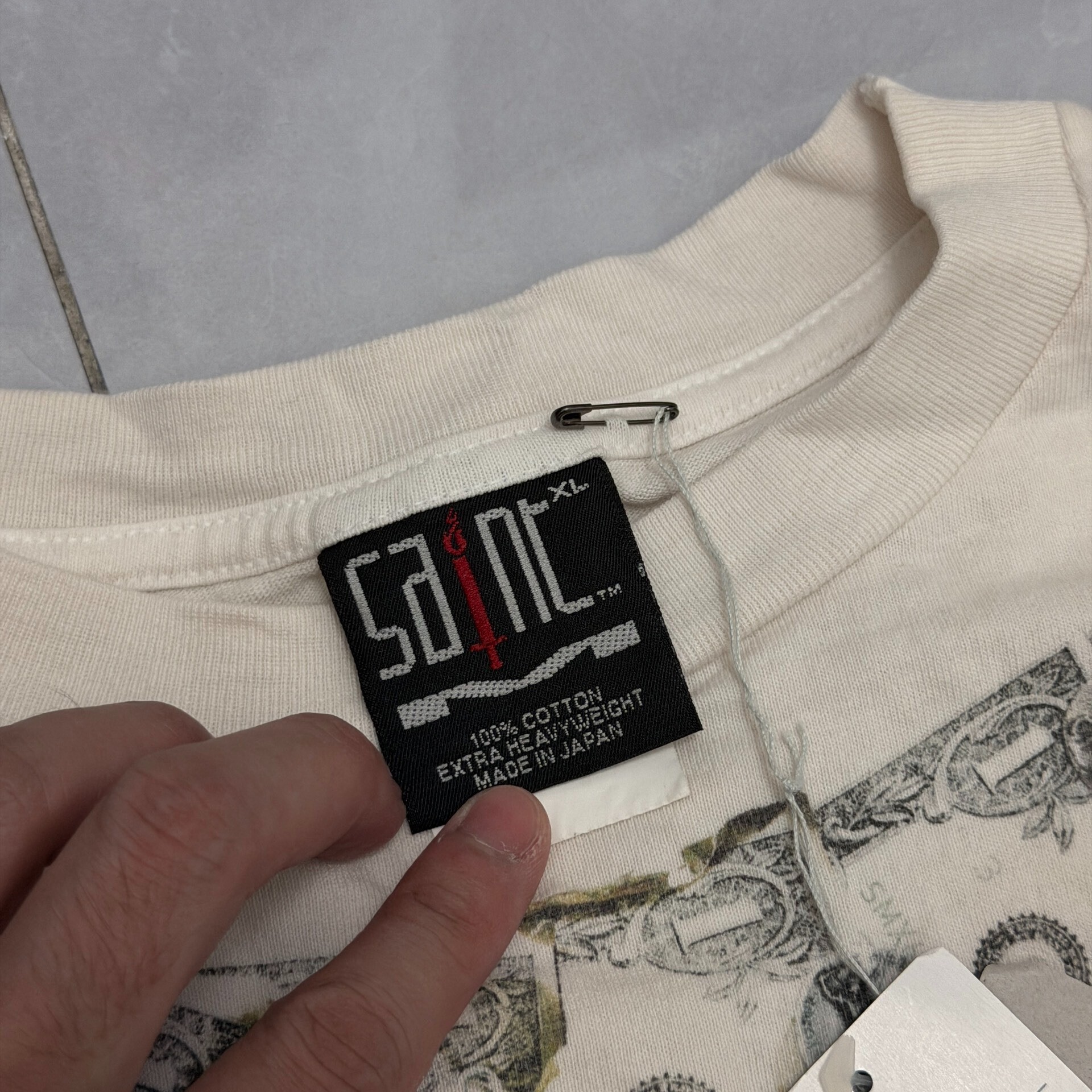 Saint Michael Dollar Print Short Sleeve Tee — label
