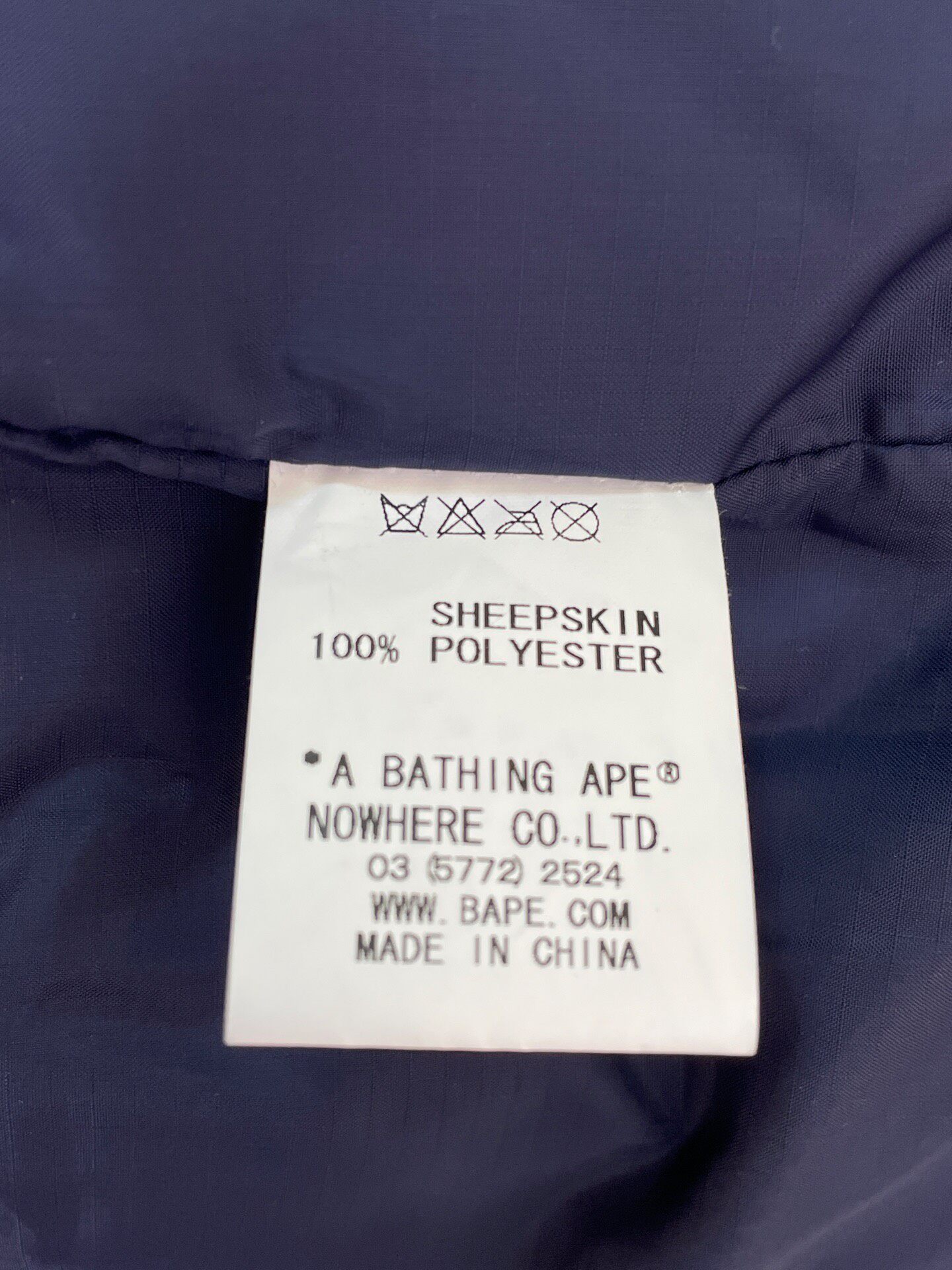 A Bathing Ape Brown Leather Down Jacket — label