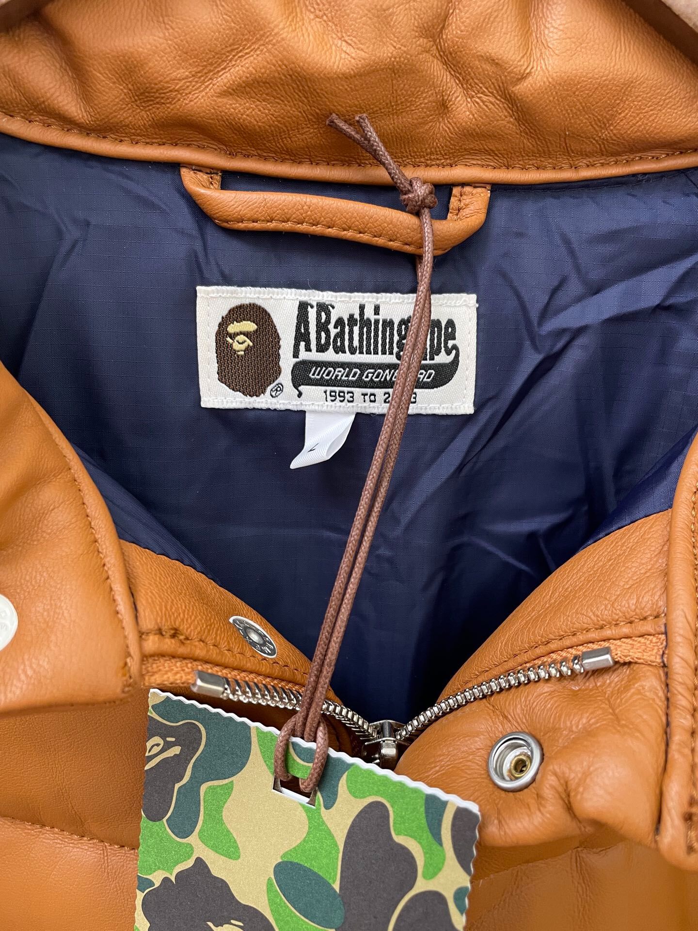 A Bathing Ape Brown Leather Down Jacket — detail