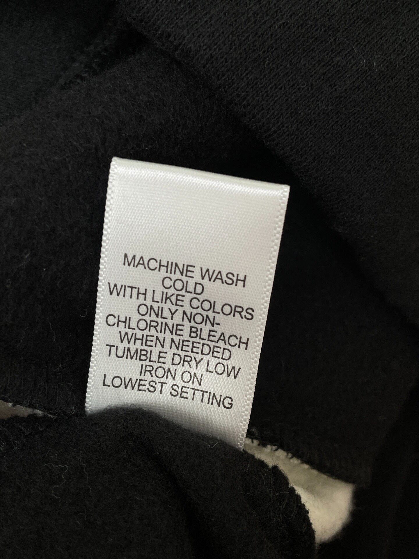 Fear of God Essentials Black Sweatpants — label