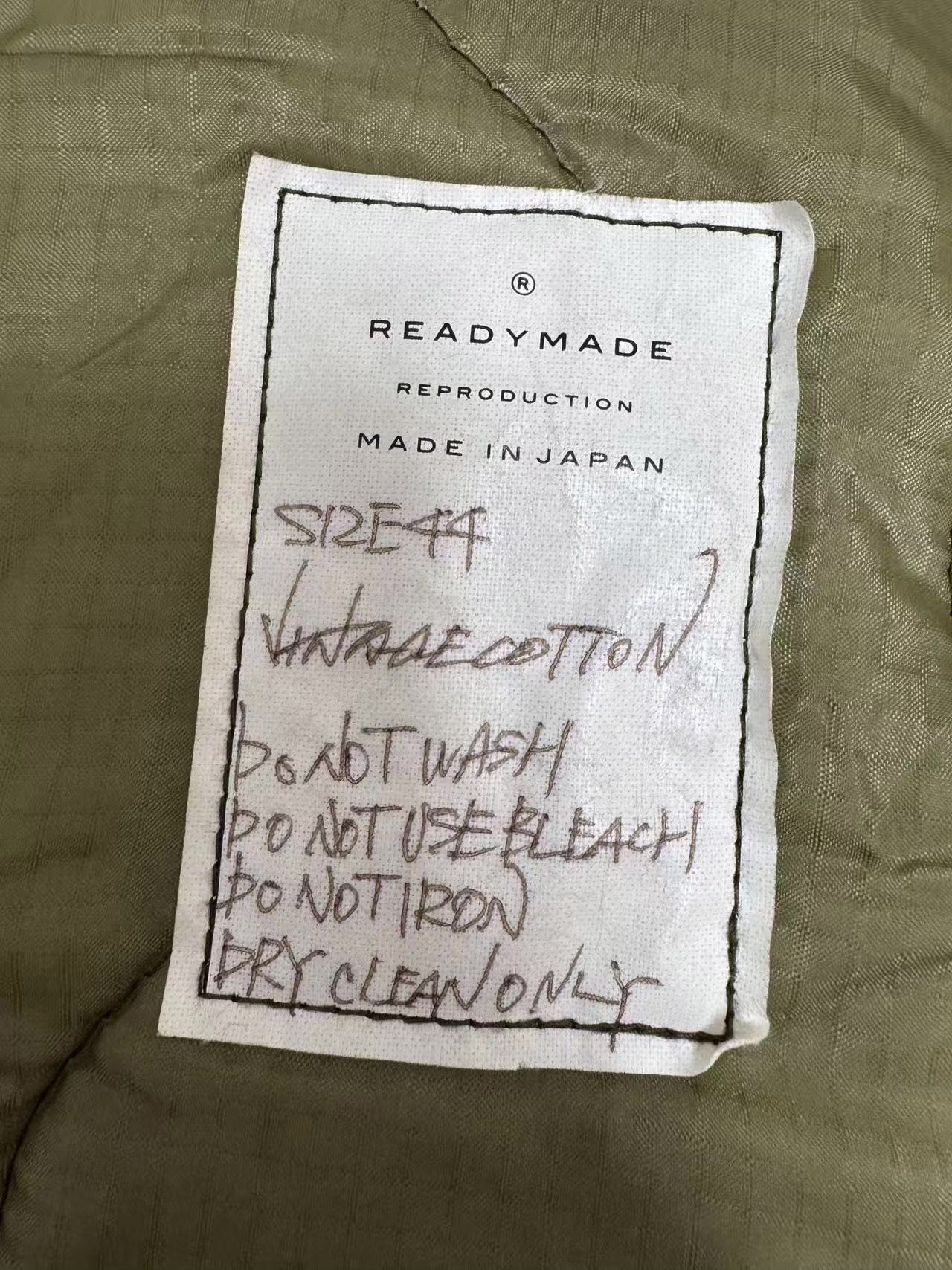 Embroidered Green Military Parka — label