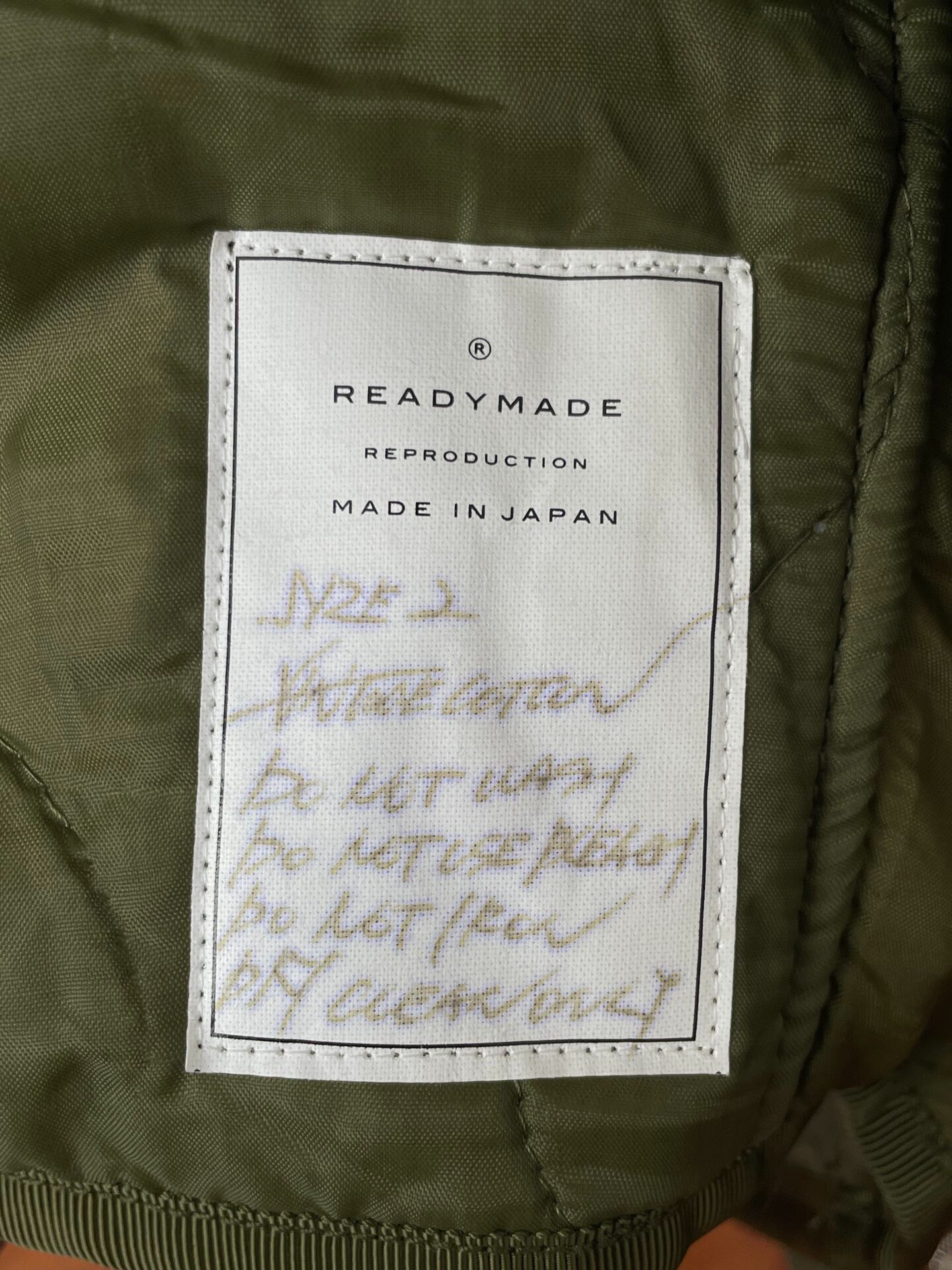Readymade Olive Green Enamel Pin Bomber Jacket — back