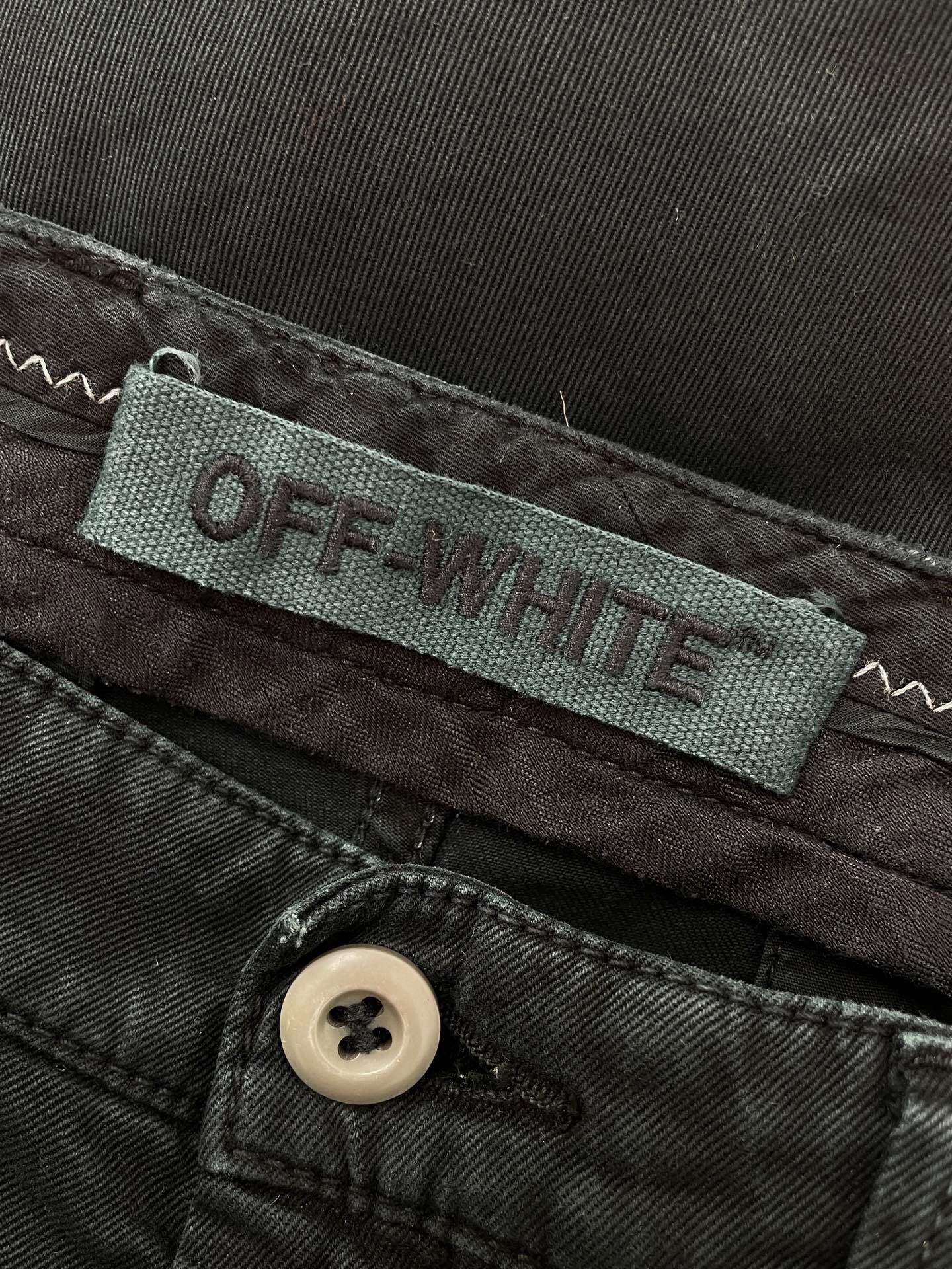 Off-White Distressed Slogan Pants — detail