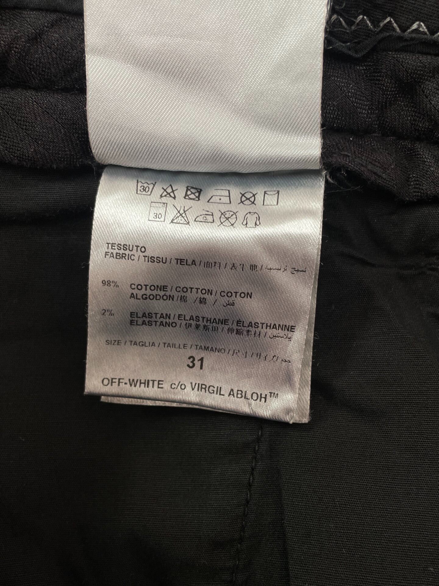 Off-White Distressed Slogan Pants — label