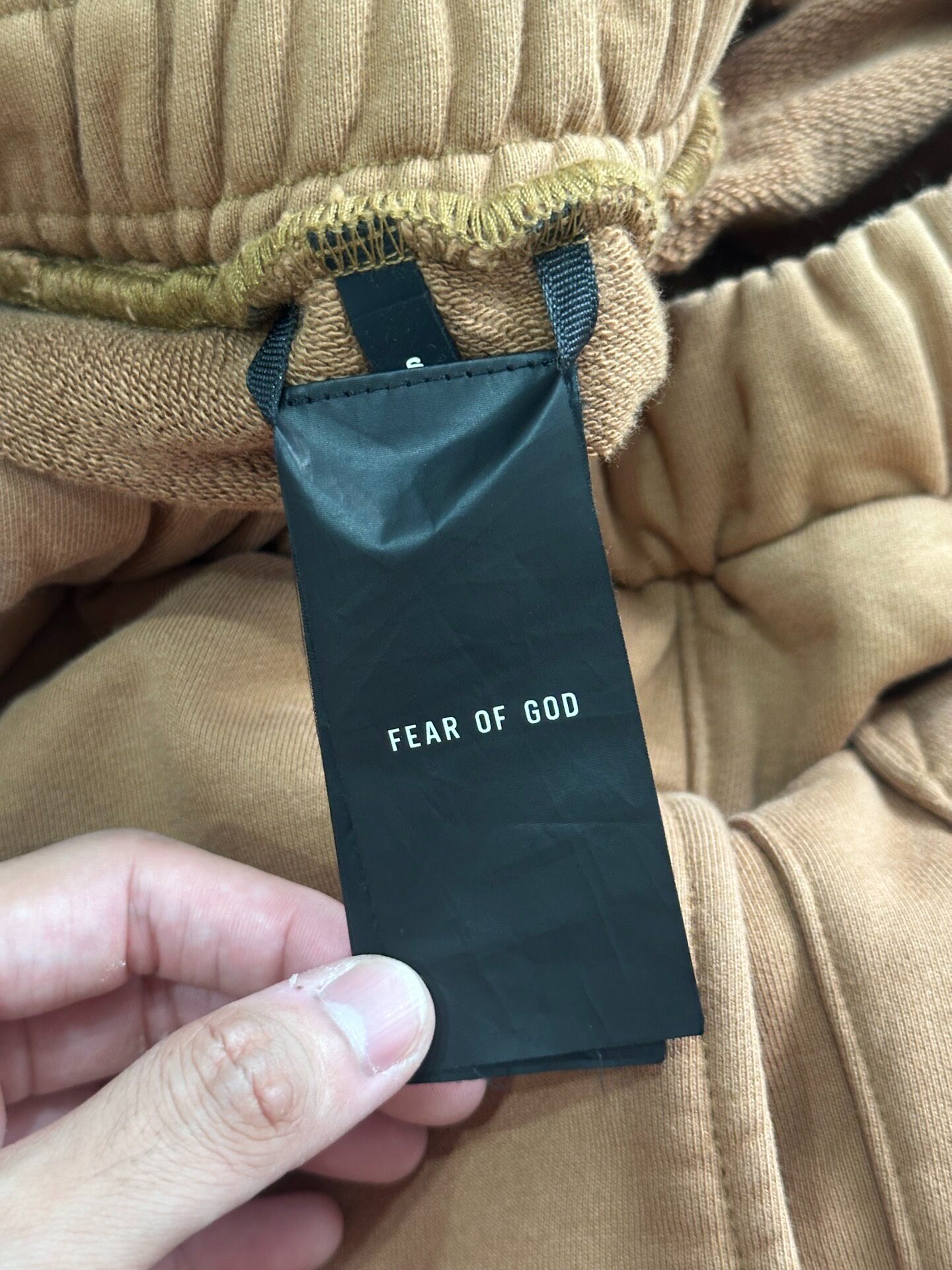 Fear of God 6th Camel Track Pants — label