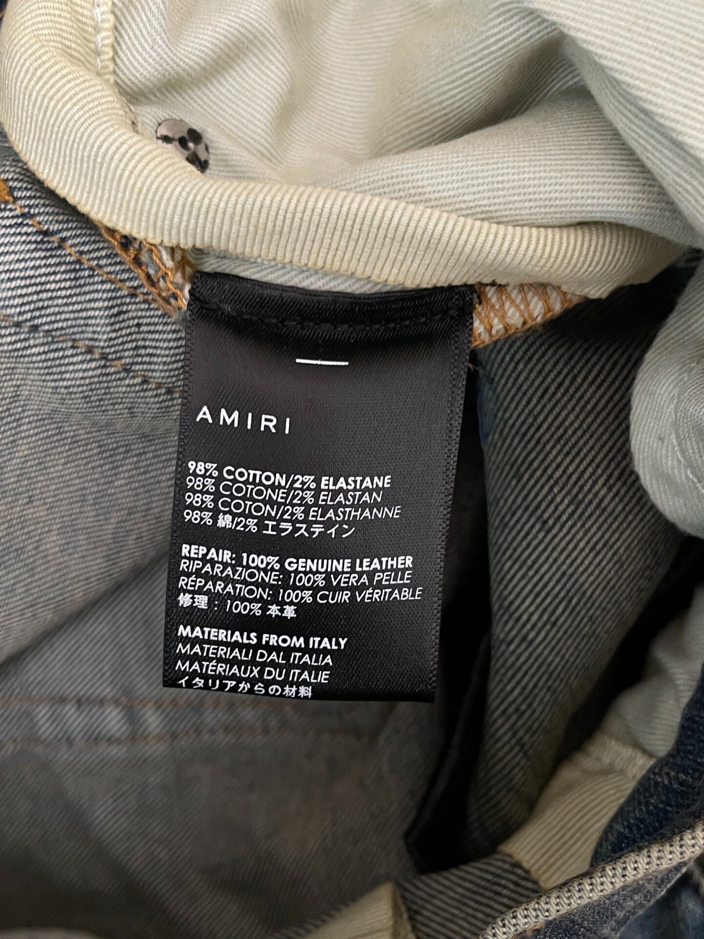AMIRI Mx1 SS22 Ripped Slim Jeans — back