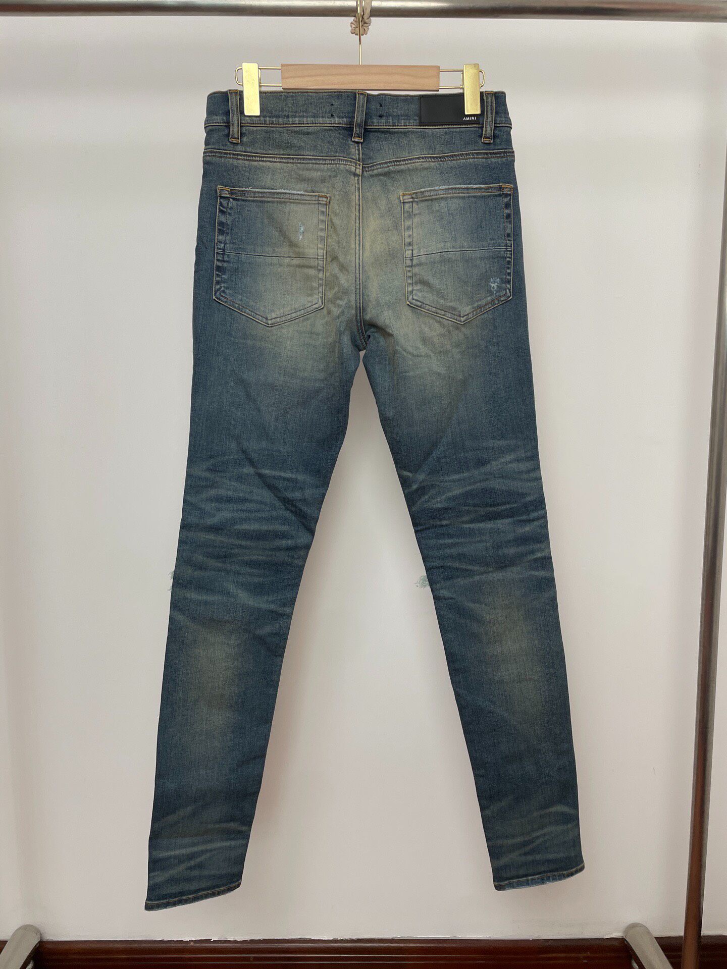 AMIRI Mx1 SS22 Ripped Slim Jeans — front