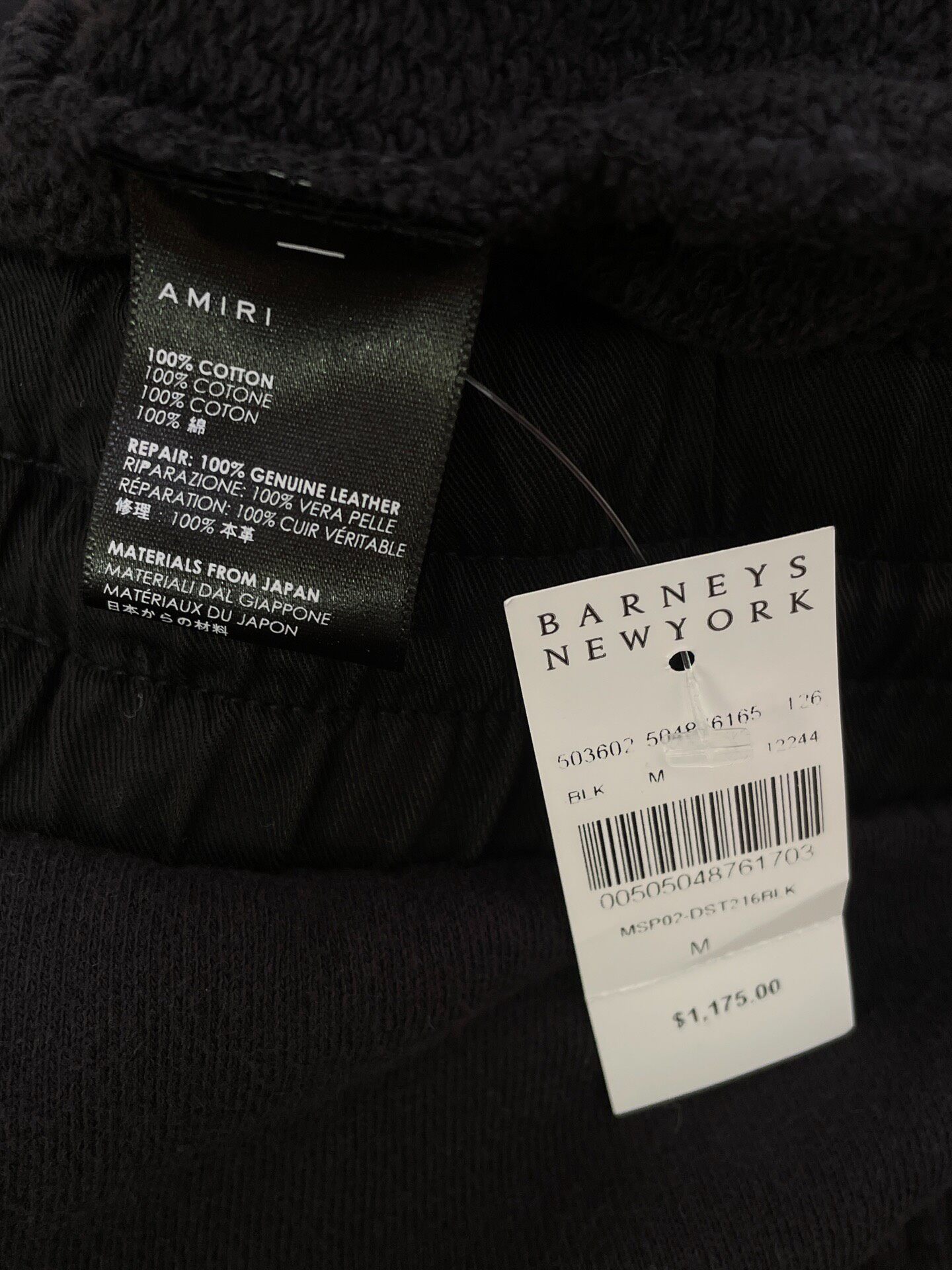 Amiri Distressed Black Pants — label