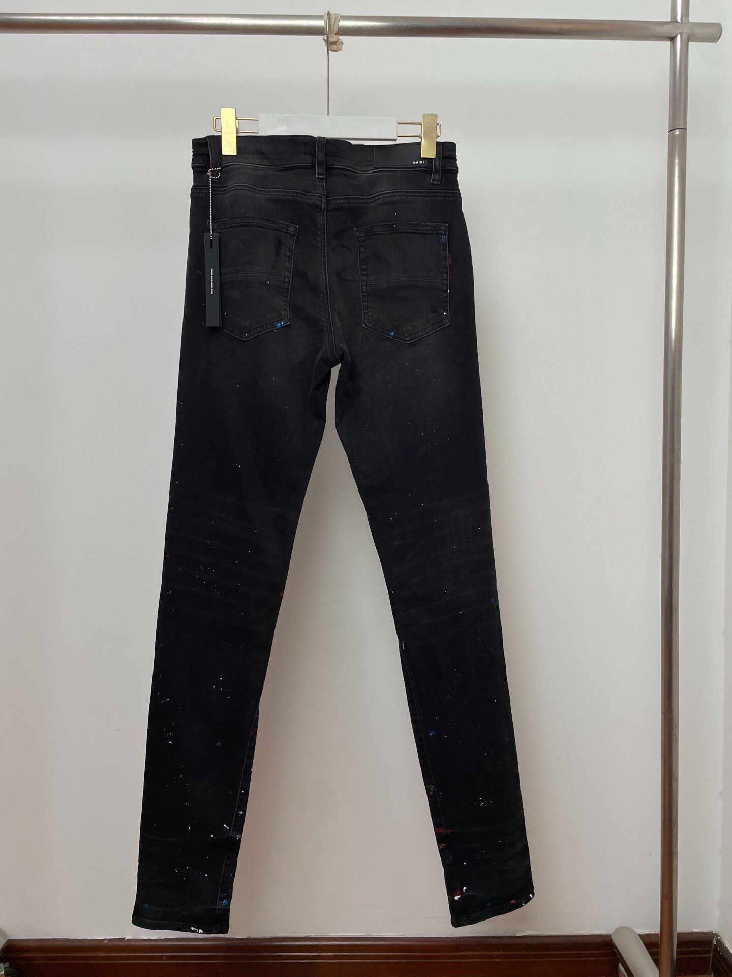 Amiri Splatter Distressed Black Jeans — front