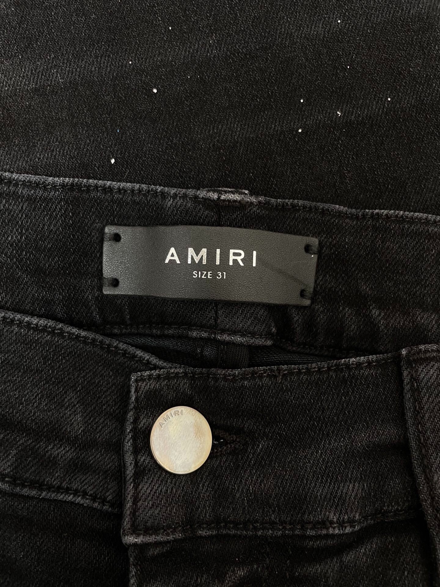 Amiri Splatter Distressed Black Jeans — detail