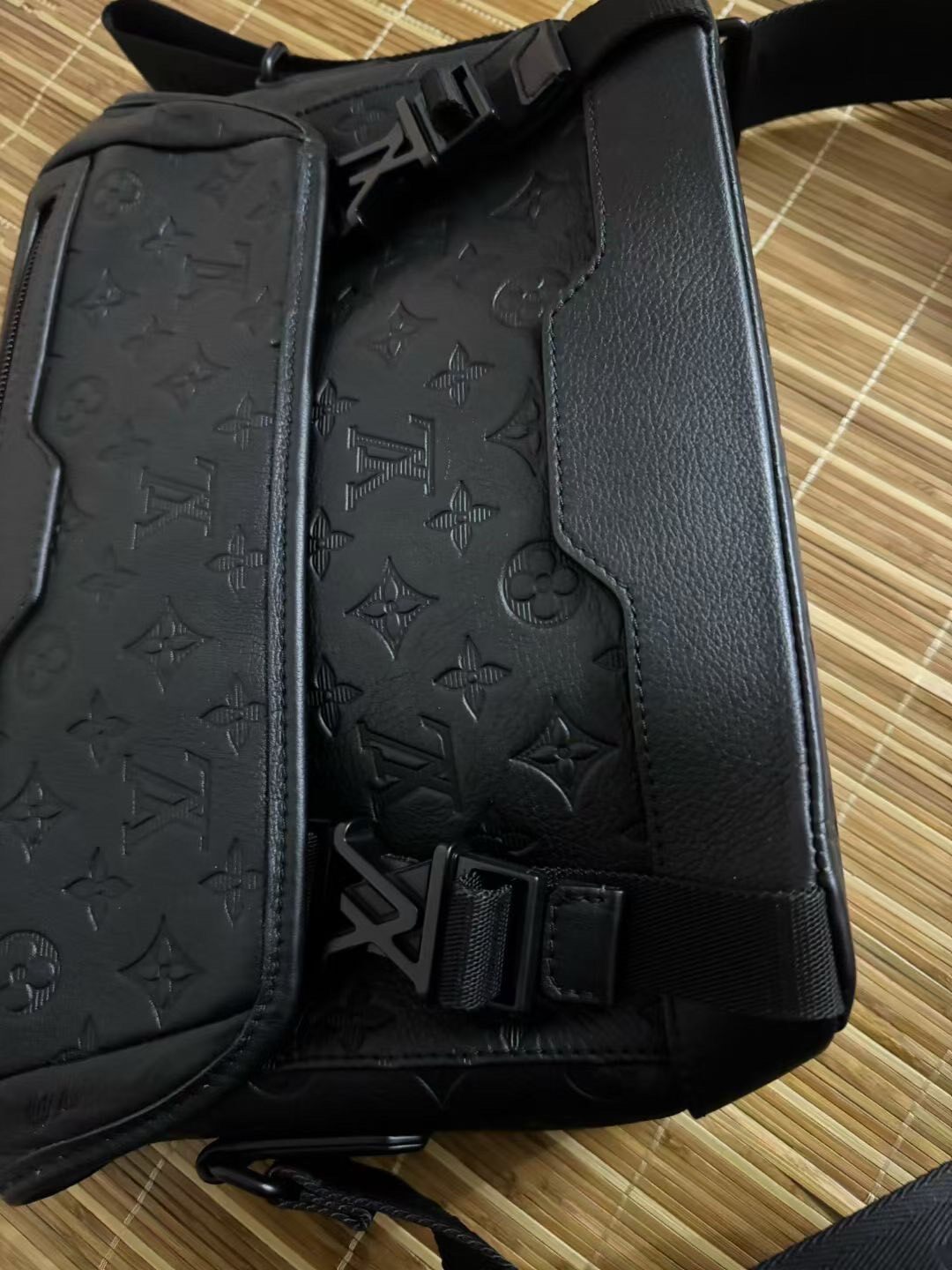 Louis Vuitton Black Embossed Messenger Bag — detail