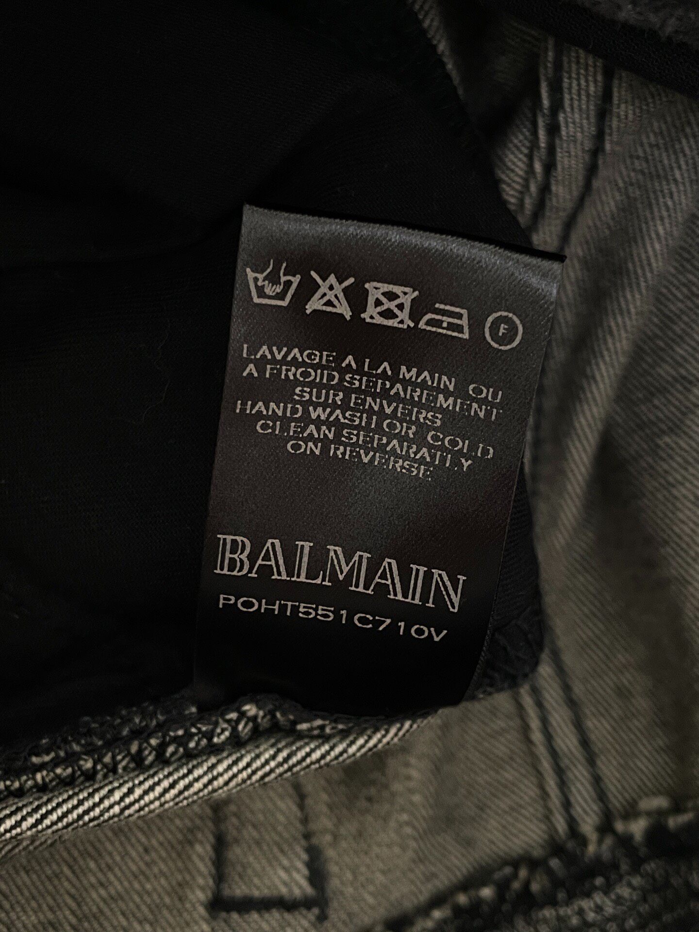 Balmain Distressed Moto Jeans — label