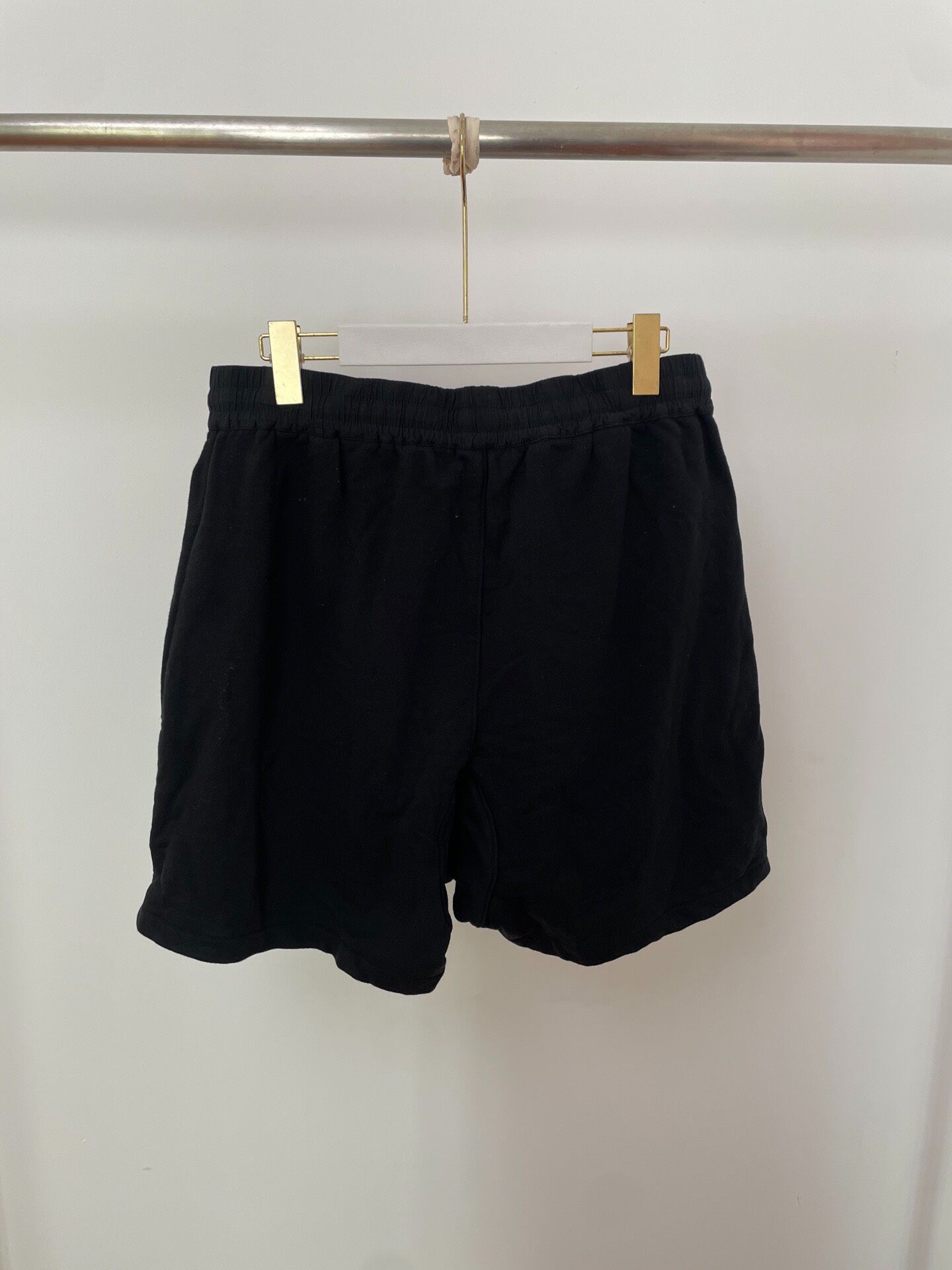 Fear of God Essentials Black Shorts — front