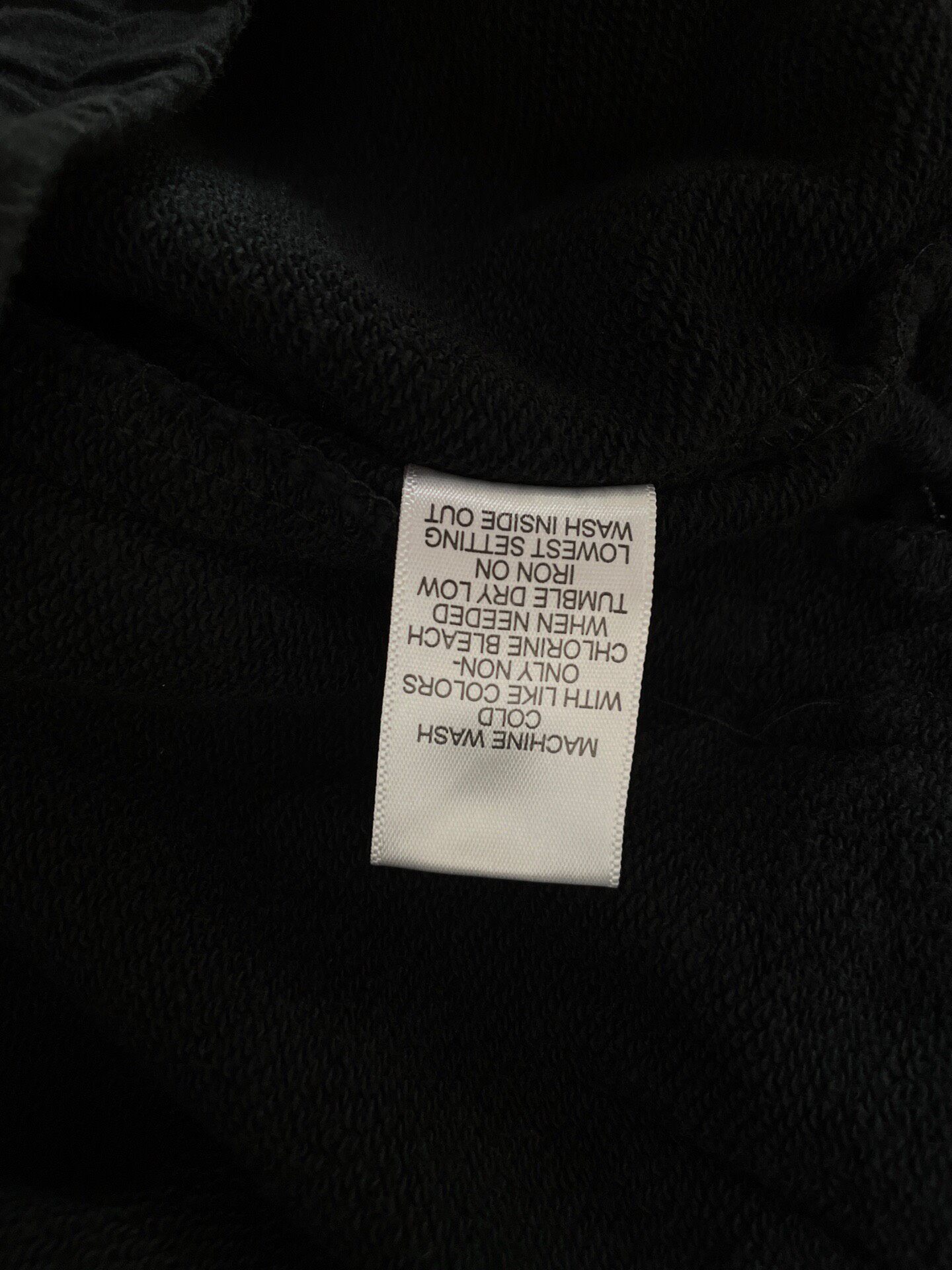 Fear of God Essentials Black Shorts — label