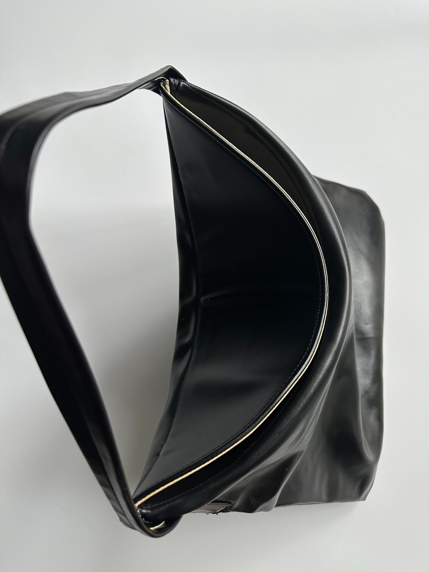 Comme des Garçons Black Leather Hobo Bag — detail