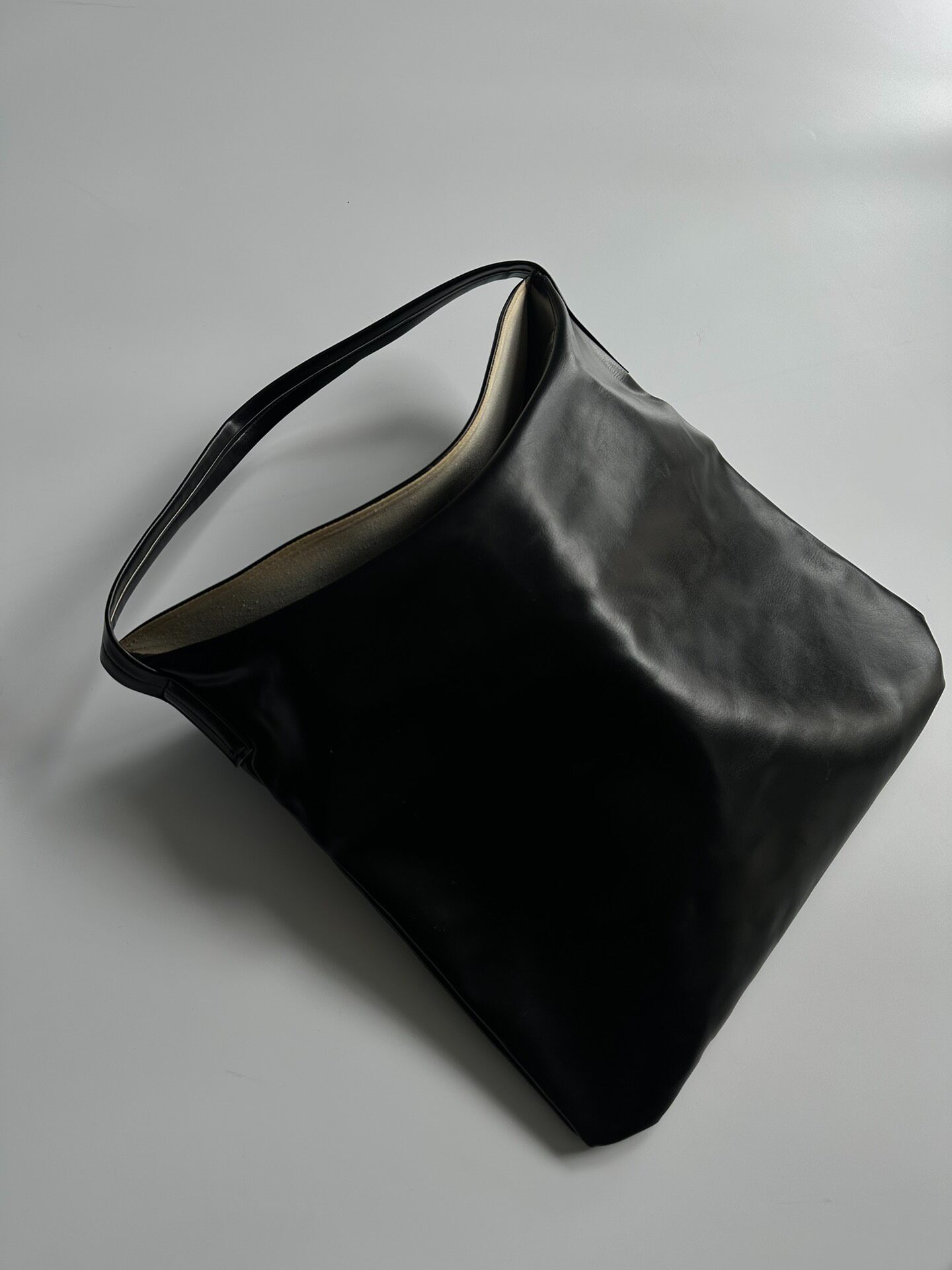 Comme des Garçons Black Leather Hobo Bag — front