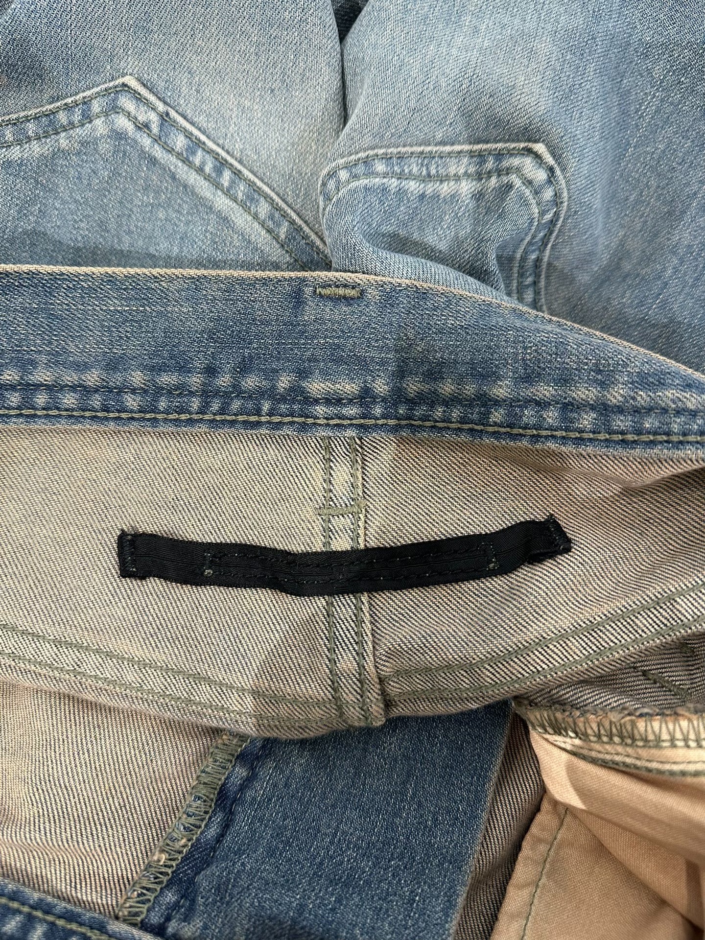 Julius7 Distressed Denim Jeans — label