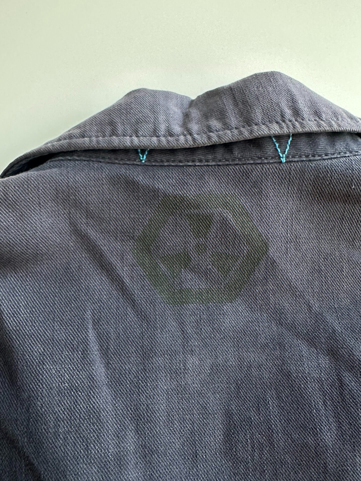 UNDERCOVER Distressed Military Jacket — label